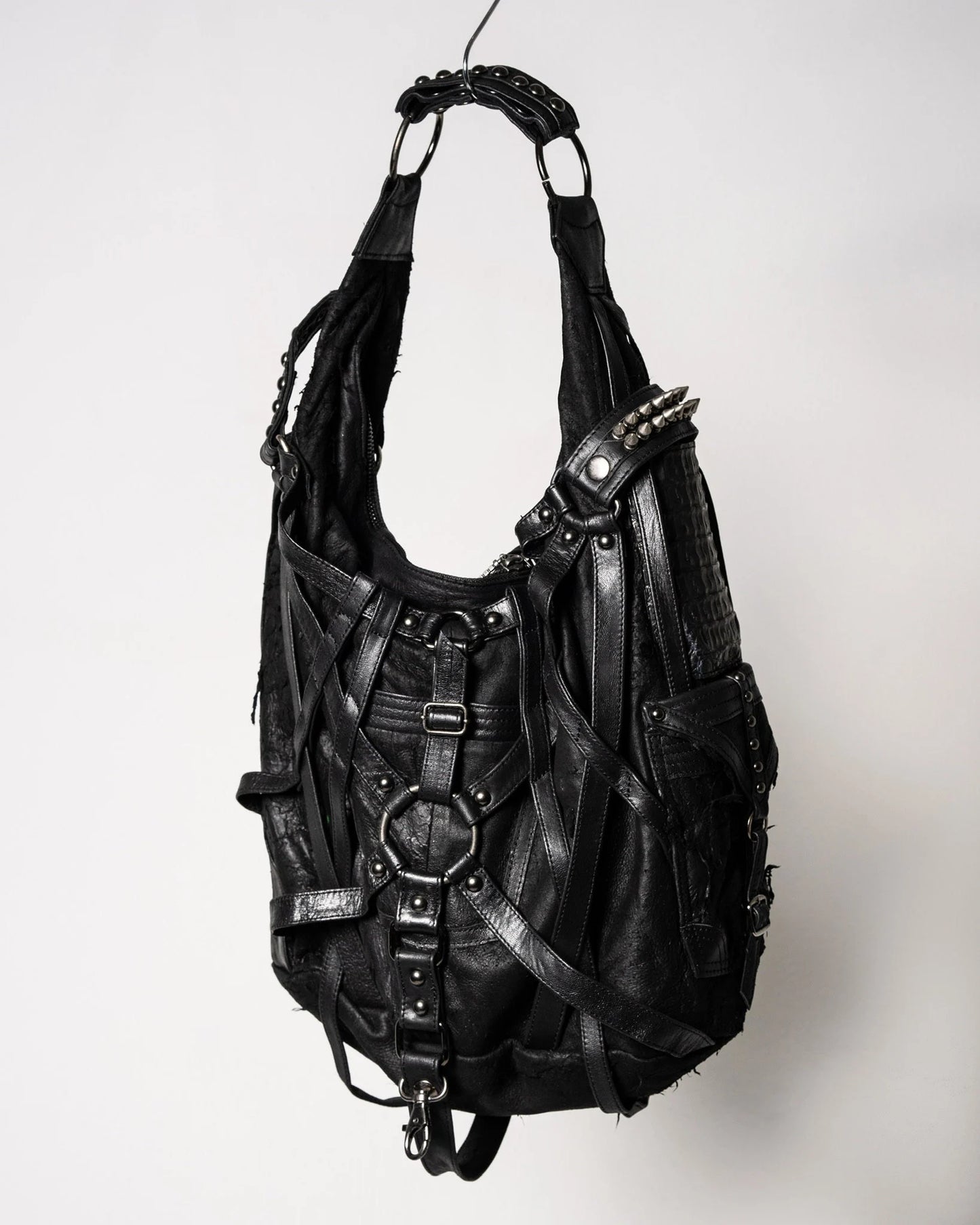 RAGE CAGE Luxe Black Leather Hobo Bag with Unique Cage Strap Design and Versatile Pockets